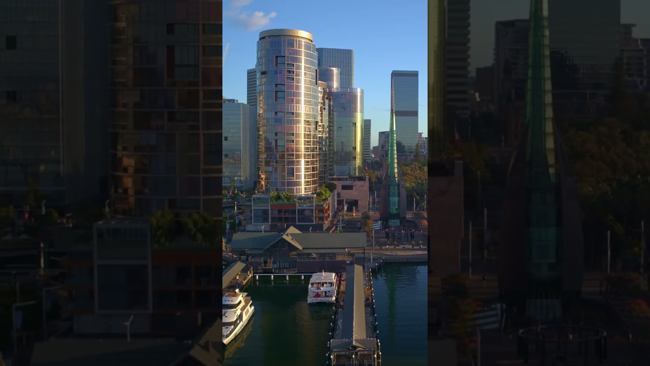 Elizabeth Quay lights up with calm skies and sunrise reflections.