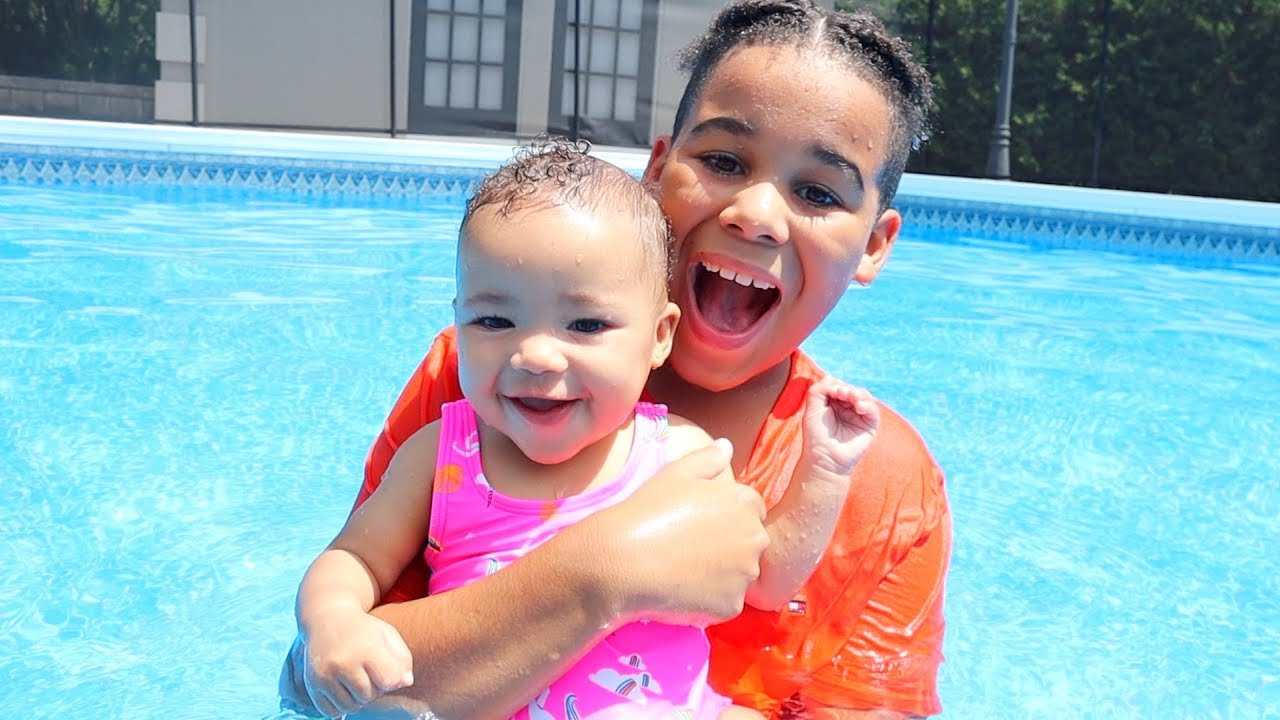Big Brother Swims with Baby Sister!