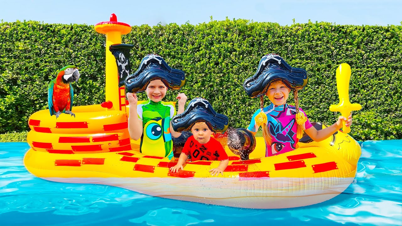 Diana and Roma have fun with inflatable toys and water balloons