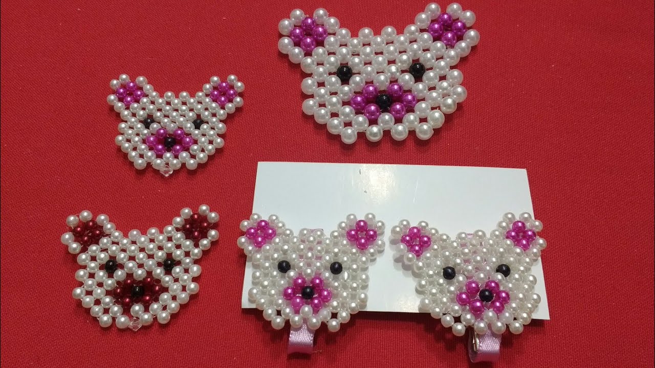 Mini ursinha de pérolas no bico de pato
