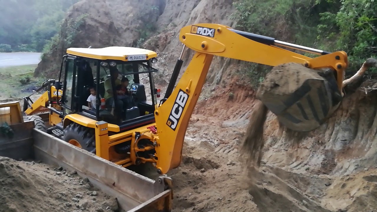 little boy operating JCB machine ## little boy driving a jcb backhoe loader