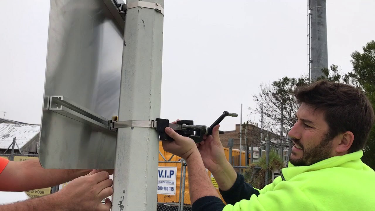 How to install a sign onto a lamp pole or utility pole