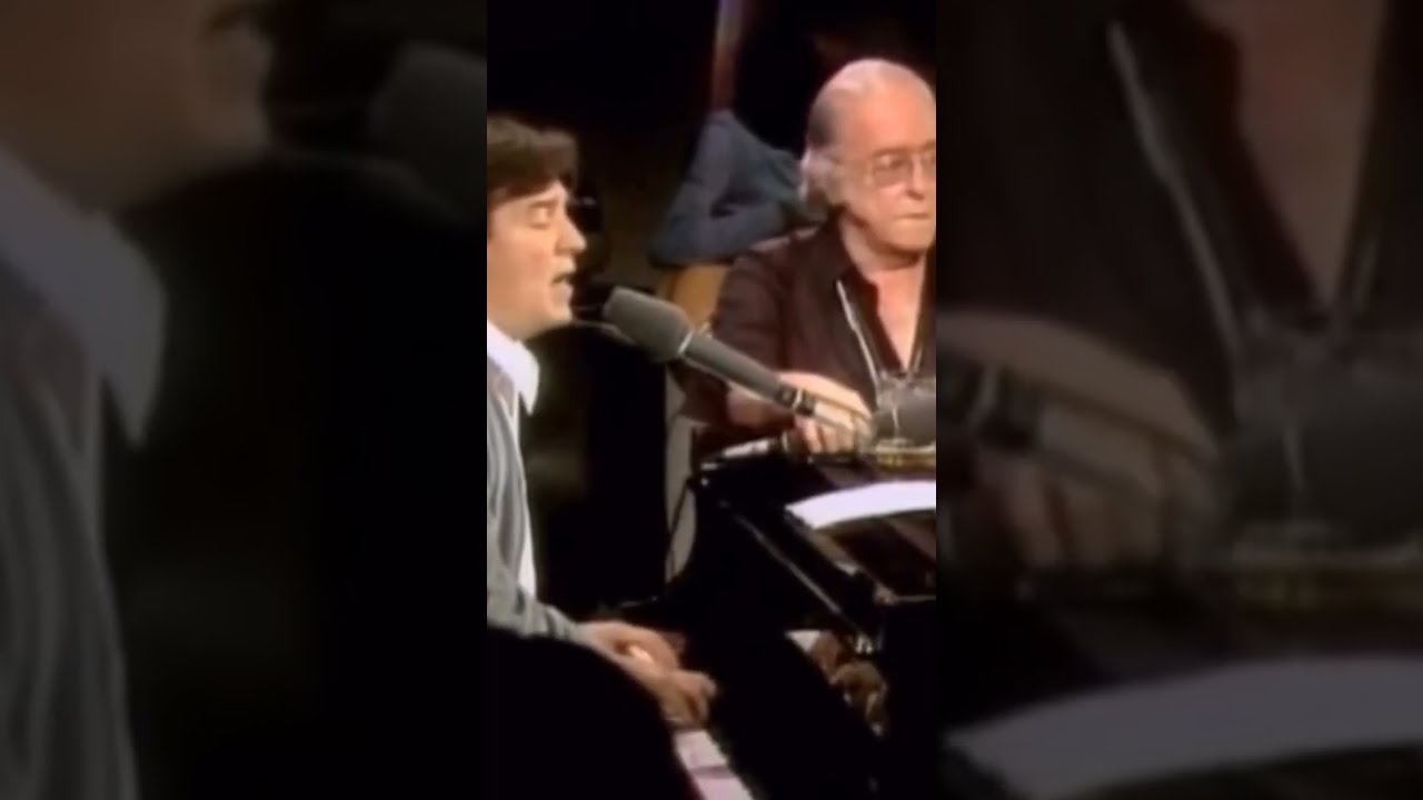 Vinicius de Moraes (vocals) and Antonio Carlos Jobim, piano (Tom Jobim) performing "A Felicidade".