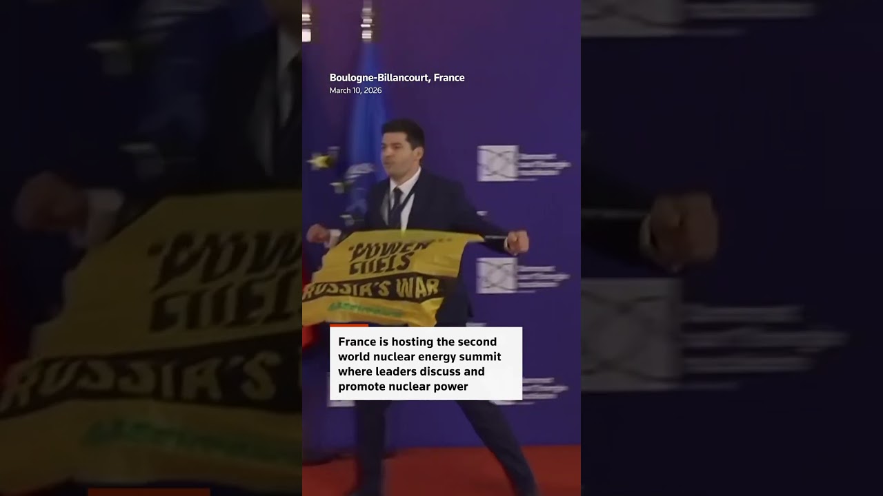 Greenpeace protesters confront Macron at nuclear summit