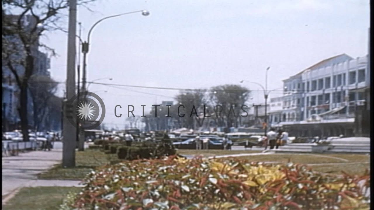 Vietnamese children in a zoo and the Capitol Military Assistance Command building...HD Stock Footage