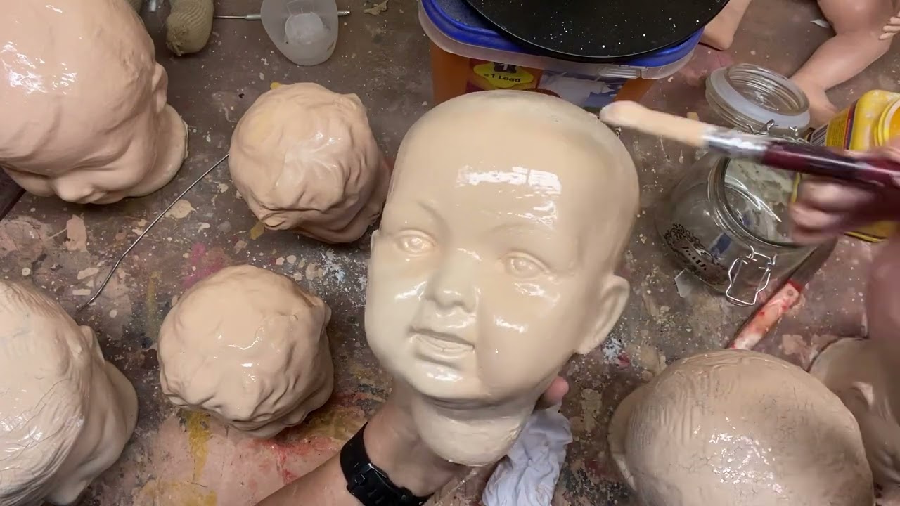Composition Doll Restoration, adding layers of flesh paint.