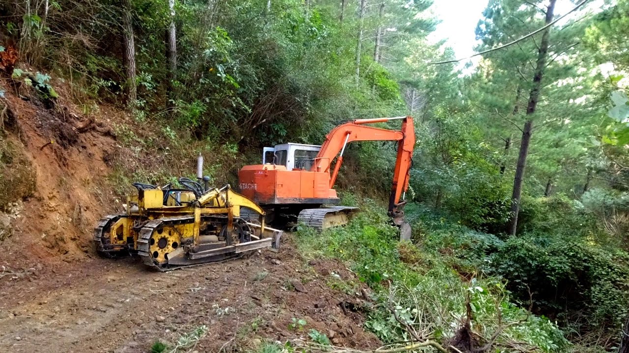 Vintage Bristol 25 Bulldozer and Abandoned Excavator widening a steep track