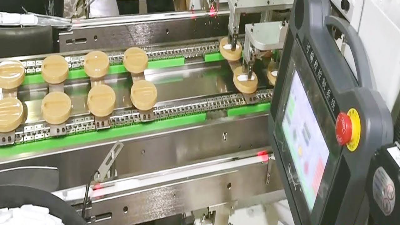 automatic spoon putting caps lids sticker labeling machine double lanes labeller