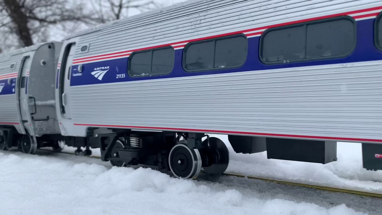 LGB Amtrak passenger train the in snow