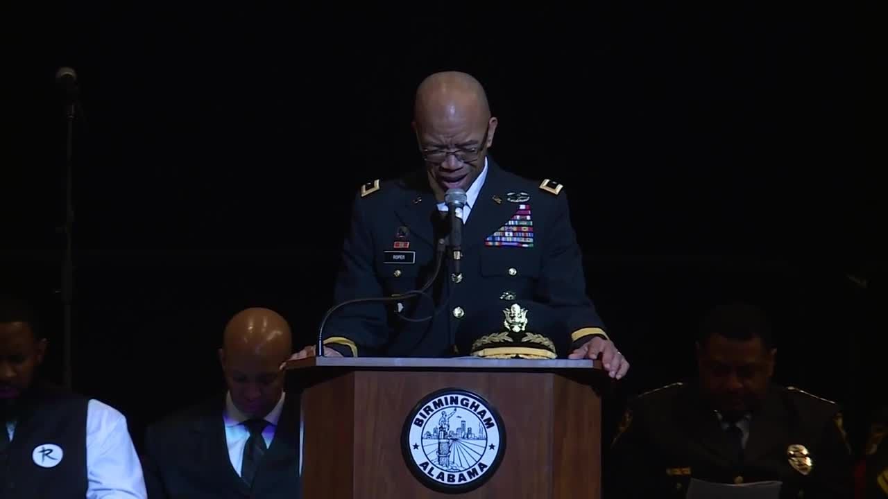 Former Birmingham police chief A.C. Roper leads a prayer at St. Wyt Carter funeral
