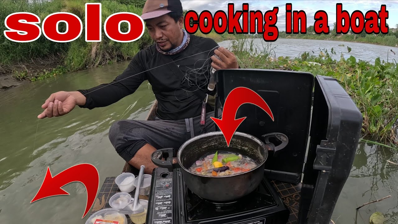 Cooking fish in a boat while fishing