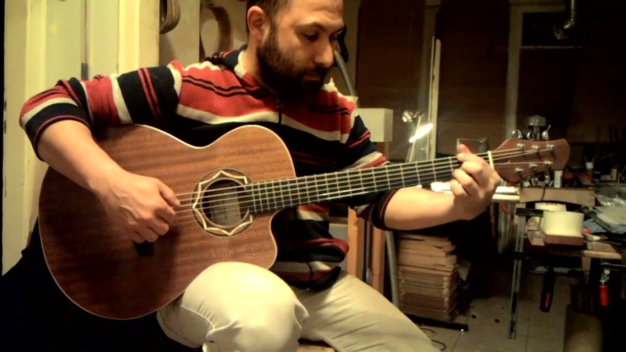Feridun Tanrıkut plays on a 2015 Feridun Tanrıkut Mahogany Acoustic Guitar