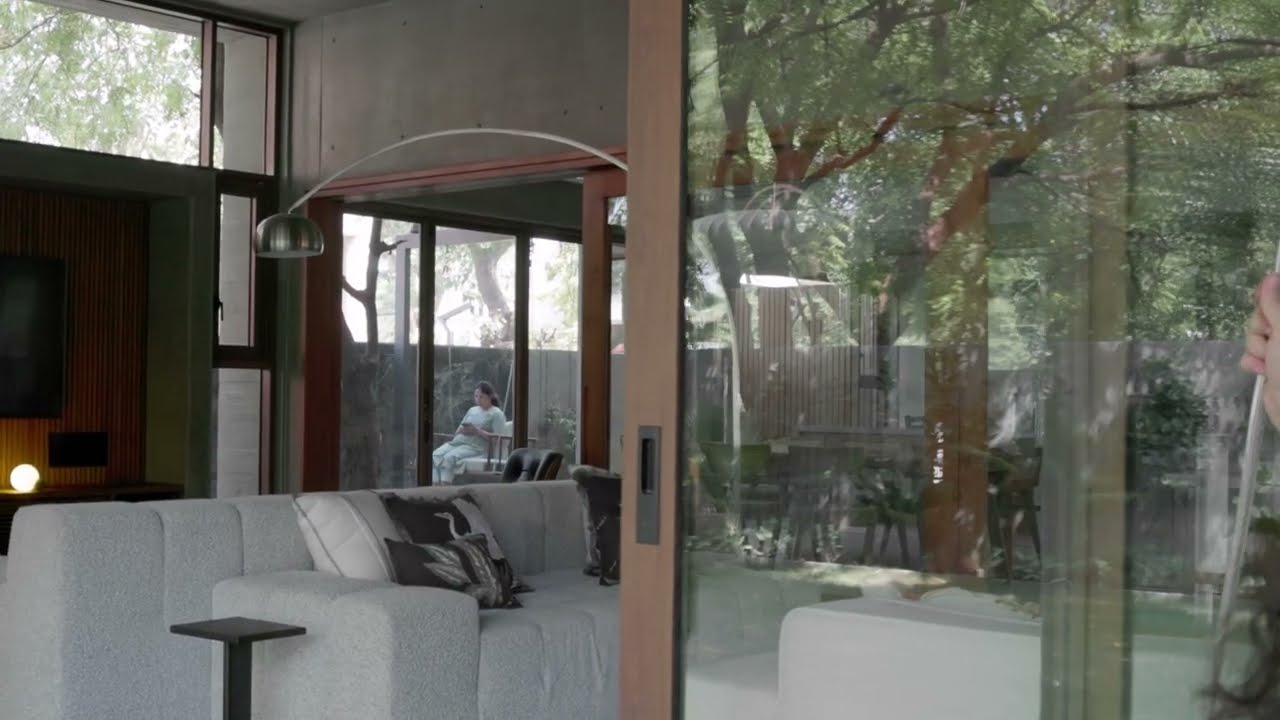 House by Studio Saransh is a brutalist home shaped by nine neem trees