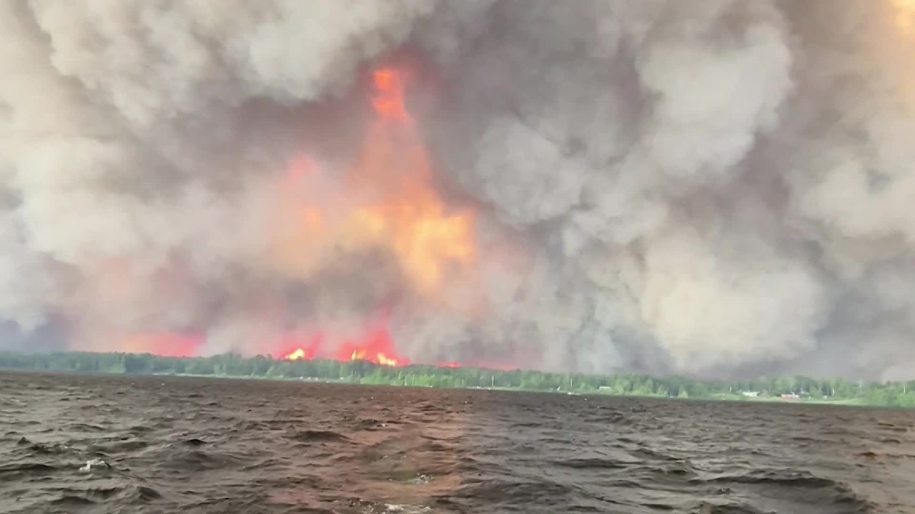 Hundreds of Wildfires Burn Across Canada Sending Smoke Into the US