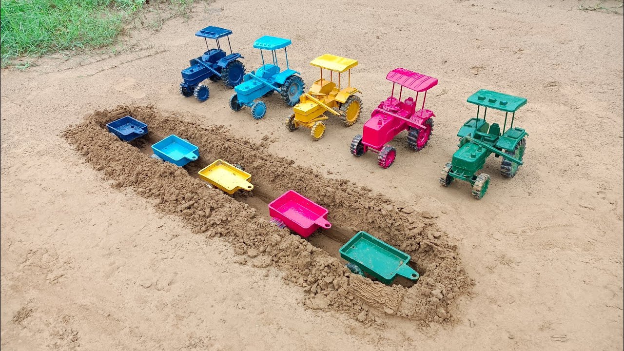 The tractor trolley got stuck inside two maids and the tractor brought a shovel#647