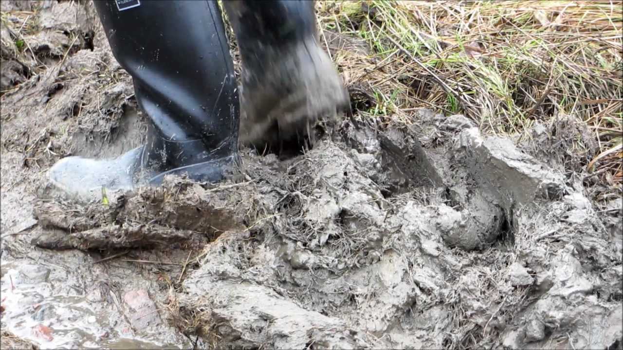 Stomping mud with my rubber boots.