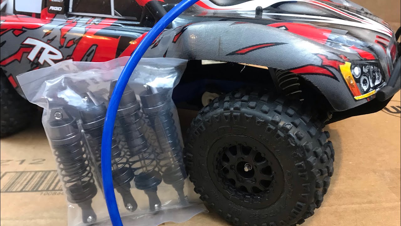 How to PREVENT Your Traxxas Slash 2wd from ROLLING!! NEW SHOCKS AND FUEL LINE HACK TO PREVENT ROLL!