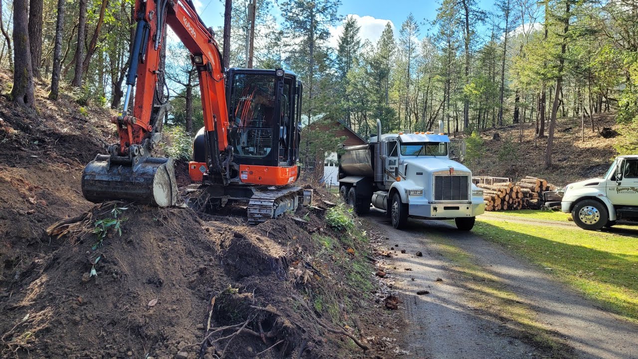 Stumping scooping and truckin with the Kubota KX-040 the fun job