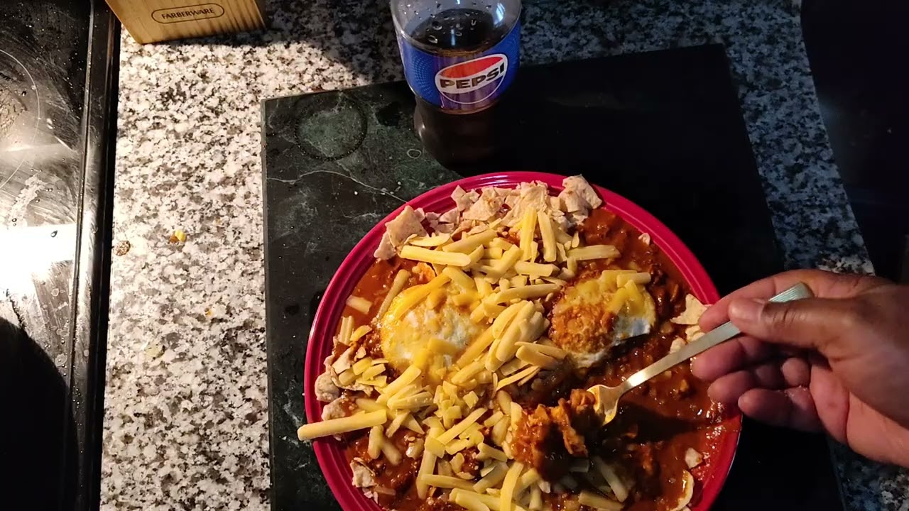Chili Cheese over Tostitos Chips with Over Easy Eggs!