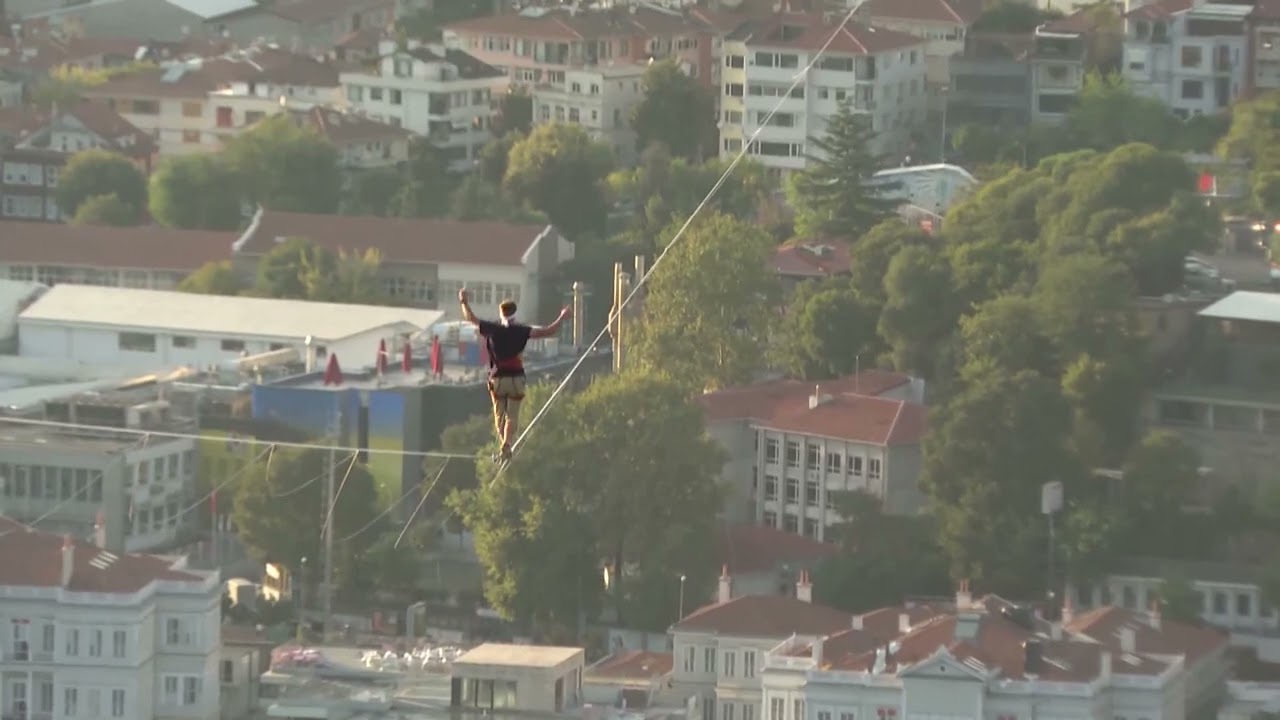 Red Bull athlete Jaan Roose walks tightrope from Asia to Europe over bridge in Türkiye's Istanbul