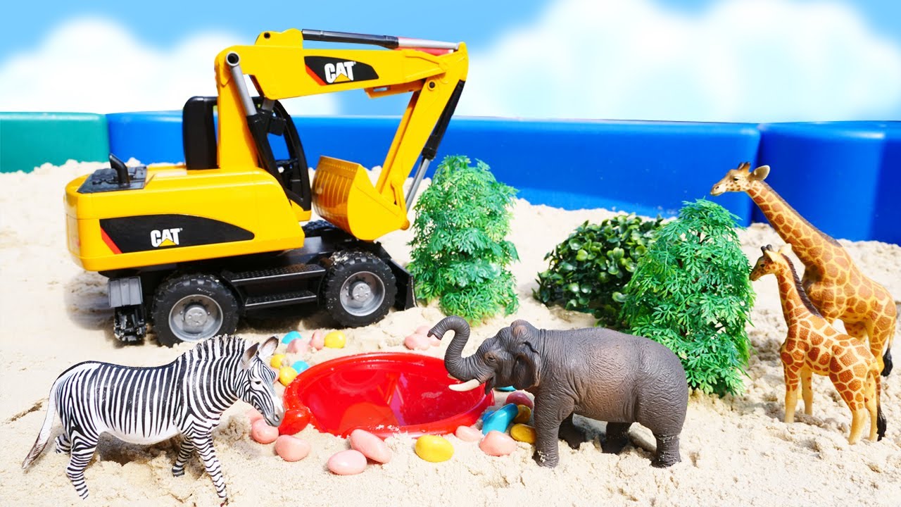 Construction vehicles build an oasis at the sandpit - Kids' videos.