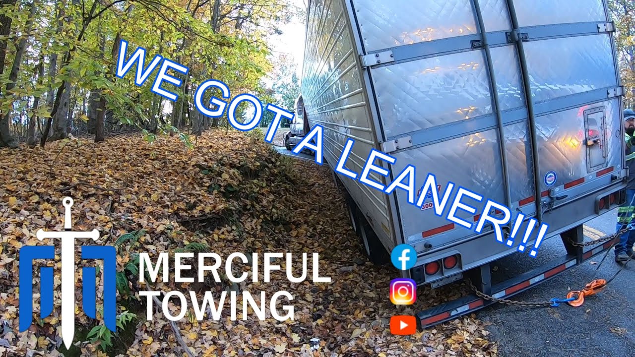 Volvo Loses Traction and Ends Up In The Ditch!! Heavy Wrecker Winchout