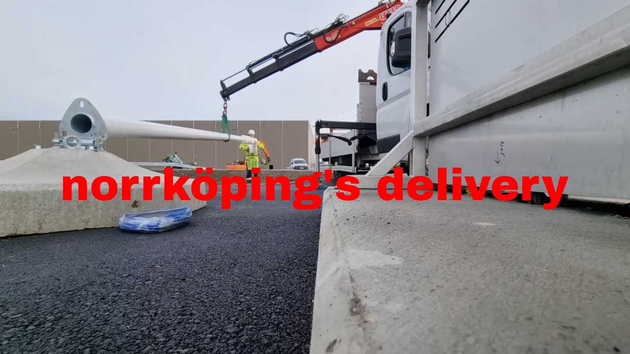 Crane works POV    Unload flagpole and concrete foundation with Fassi Micro 25