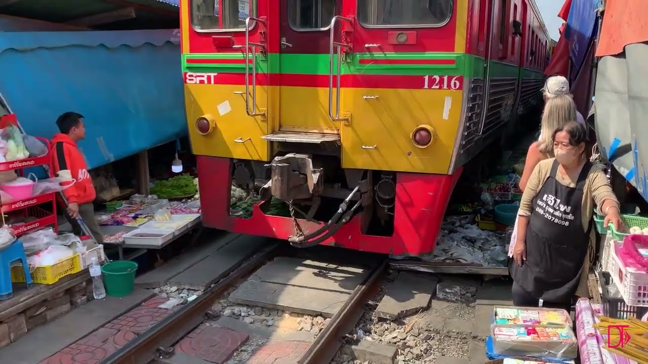 MAE KLONG RAILWAY 🚞 Train Market. TRAIN DRIVES by INCHES from your FACE!!
