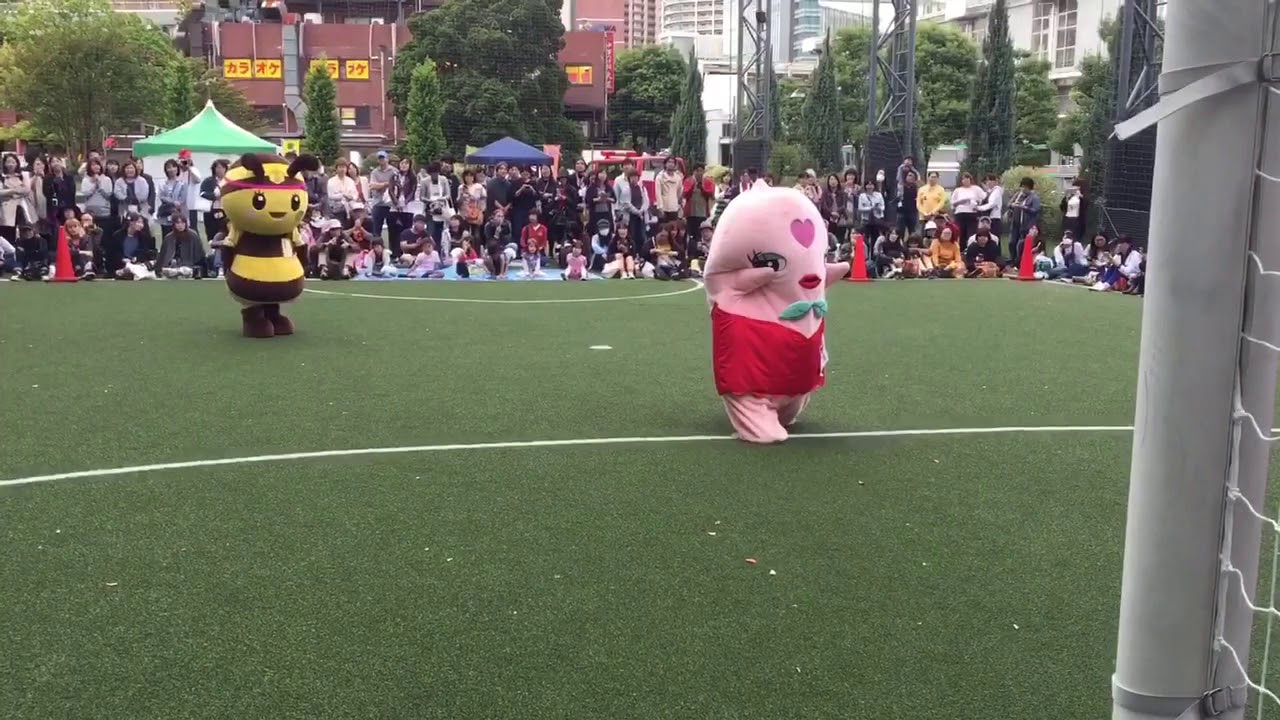 Japanese mascots playing soccer