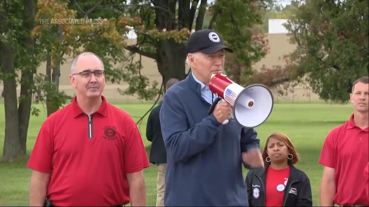 Biden visits UAW picket line, tells union to 'stick with it'