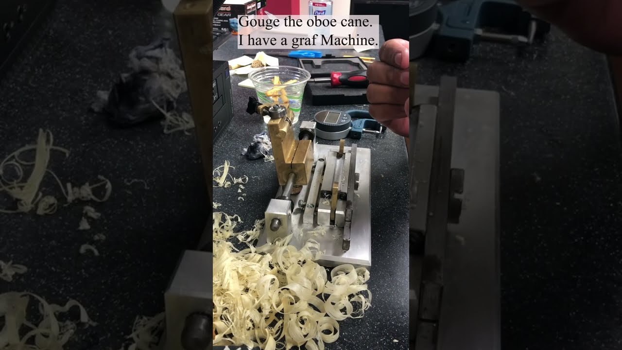 Gouging oboe cane.