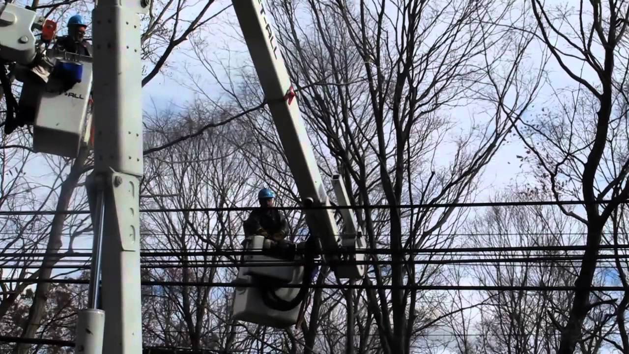 Superstorm Sandy - Con Edison Crew Helps Open a Roadway for Emergency Vehicles