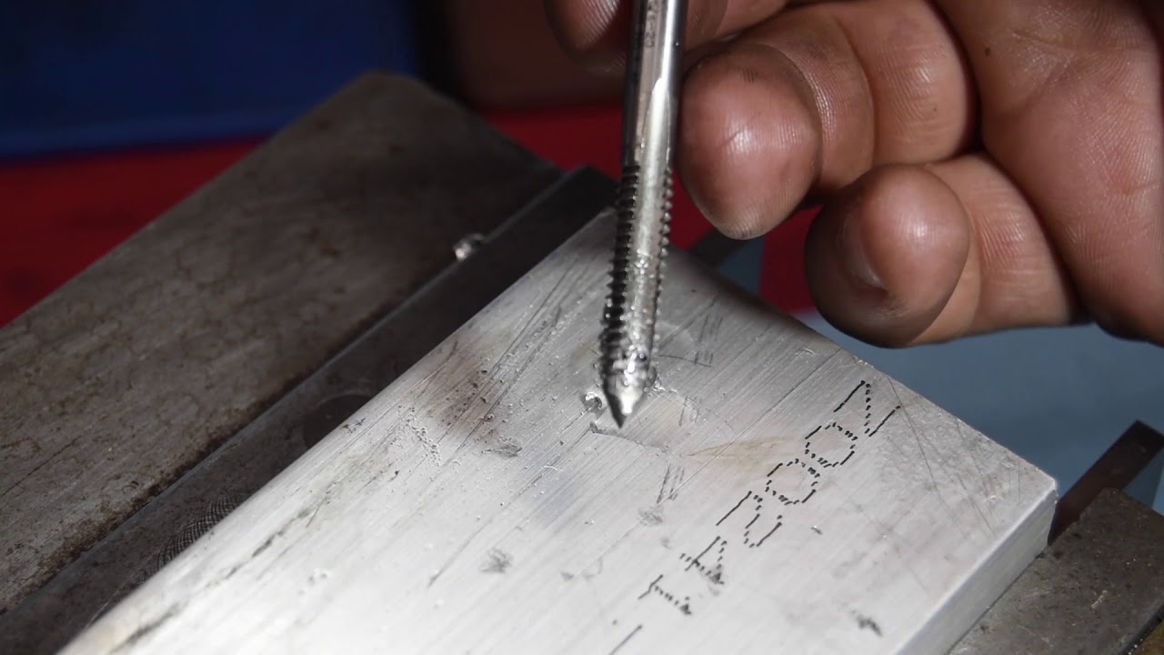 Threading a hole and installing wire thread repair.