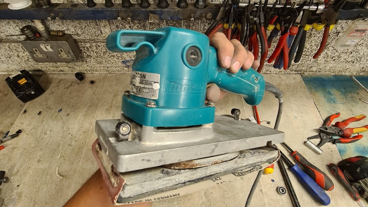 How to repair a Makita 9045N sander with a broken handle and bad bearings.