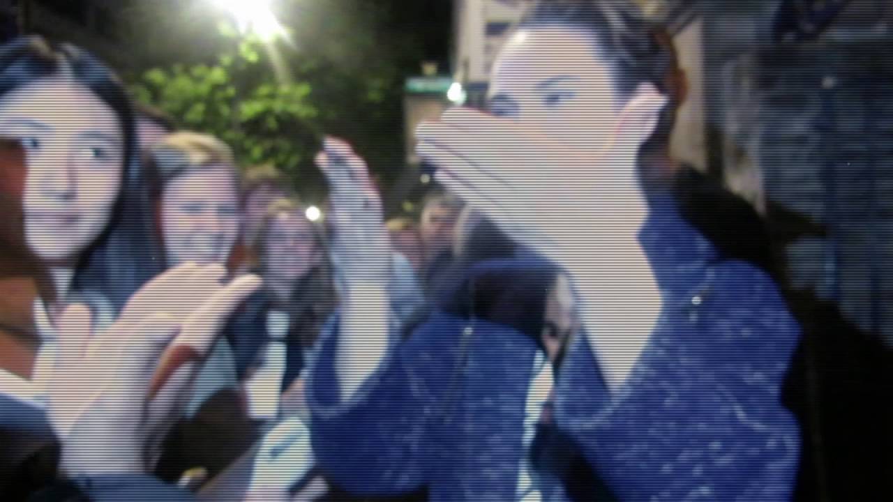 Lily James learning sign language with some fans