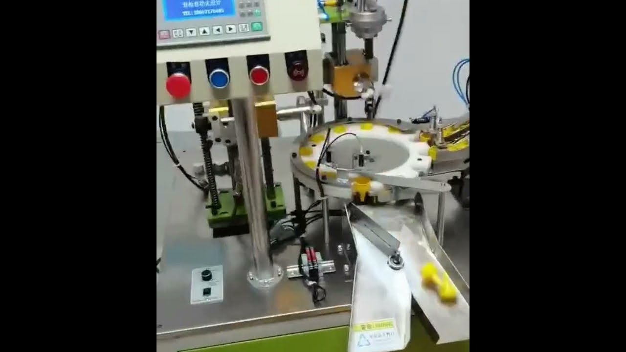 Automatic rotary two head pointed cap wadding foil lining machine