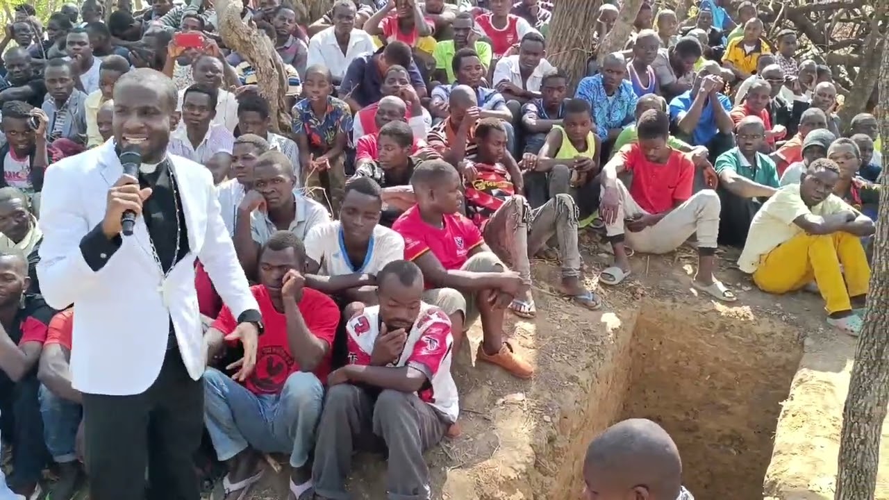 Rev Alexander Kambiri preaching at a funeral service in Malomo Ntchisi