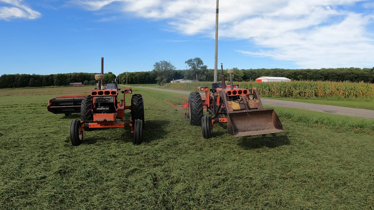 Allis-Chalmers 175 and 185, mowing and tedding hay.