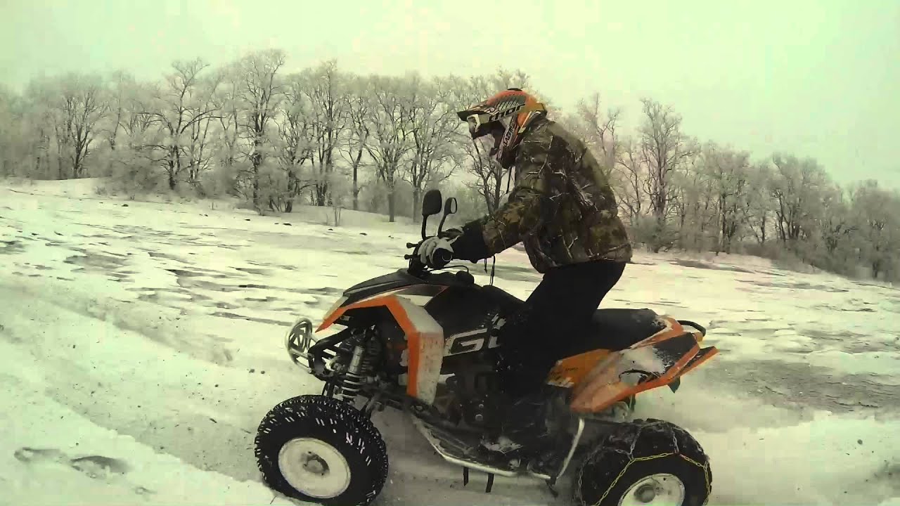 Snow riding on ATV on the fields