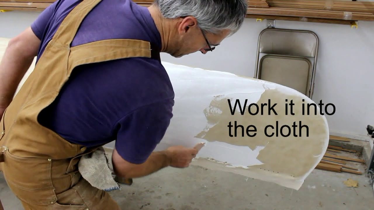 Filling canvas on a wood canvas canoe