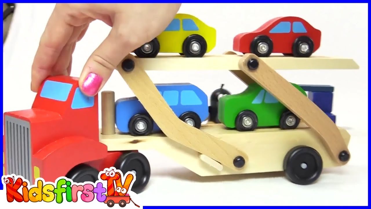 Colors for kids with a car transporter & toy cars.
