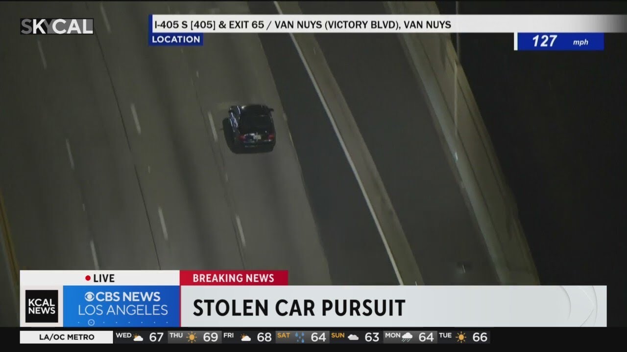 Stolen car speeds past traffic, crashes into divider during pursuit