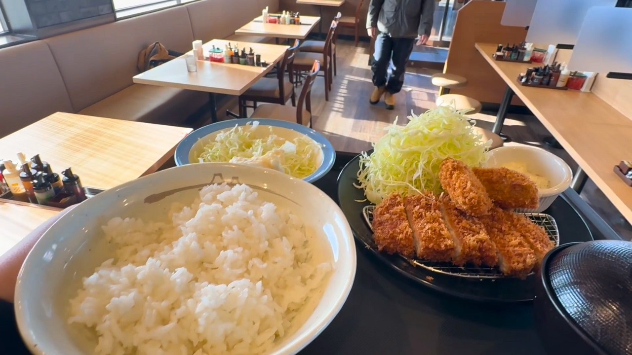 A Japanese nurse eating tonkatsu and fried oysters for lunch after a night shift