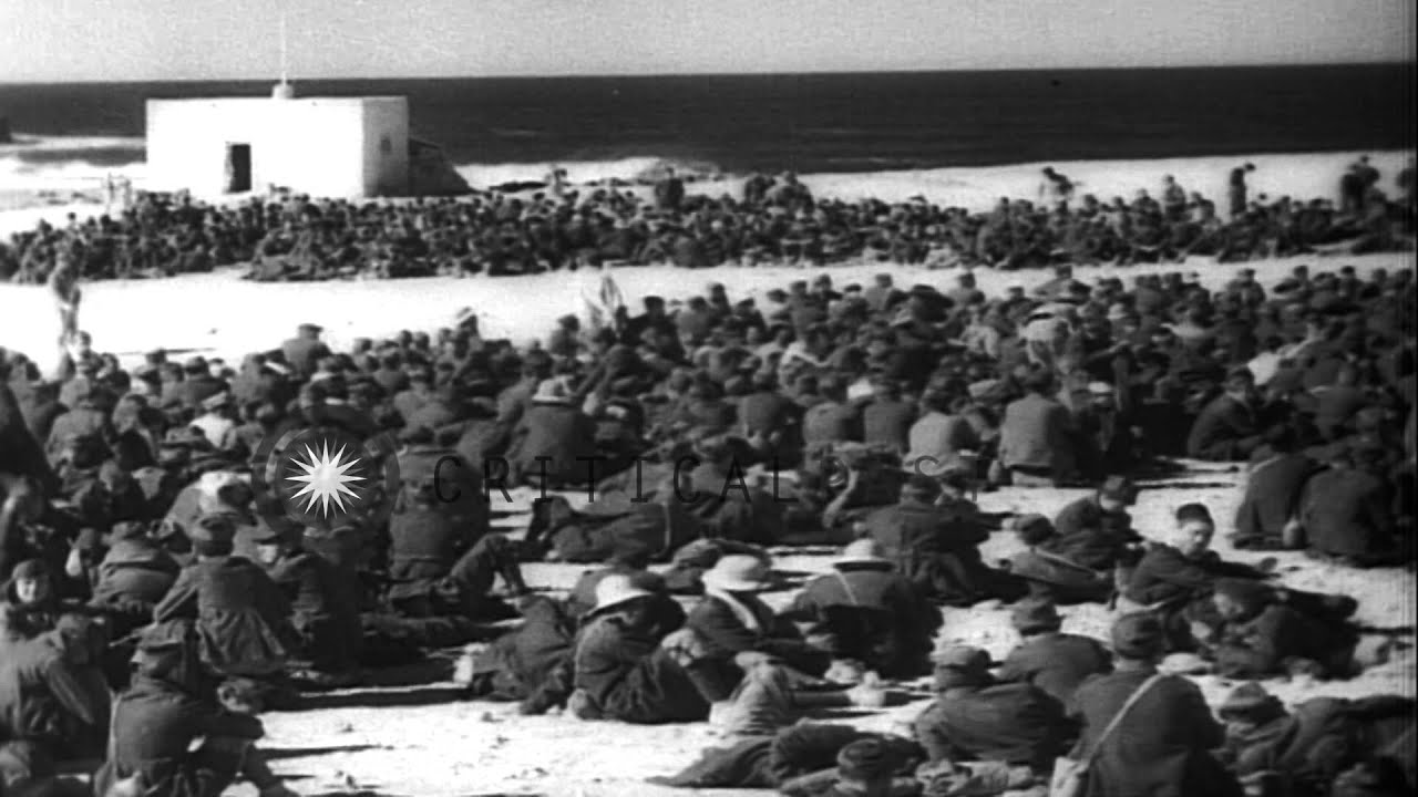 Italian prisoners captured by the British move with their luggage through the rug...HD Stock Footage