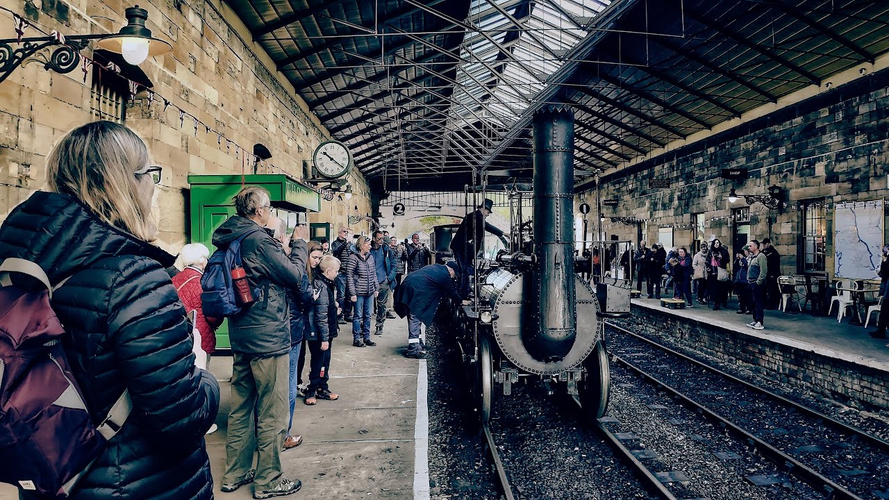 Replica steam Locomotion No. 1 train heading to Pickering railway station Yorkshire England.