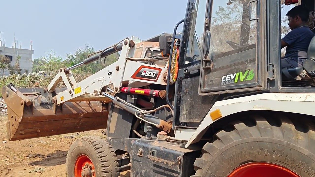 Child trainer operating the Back loader. Don't try this without Training.