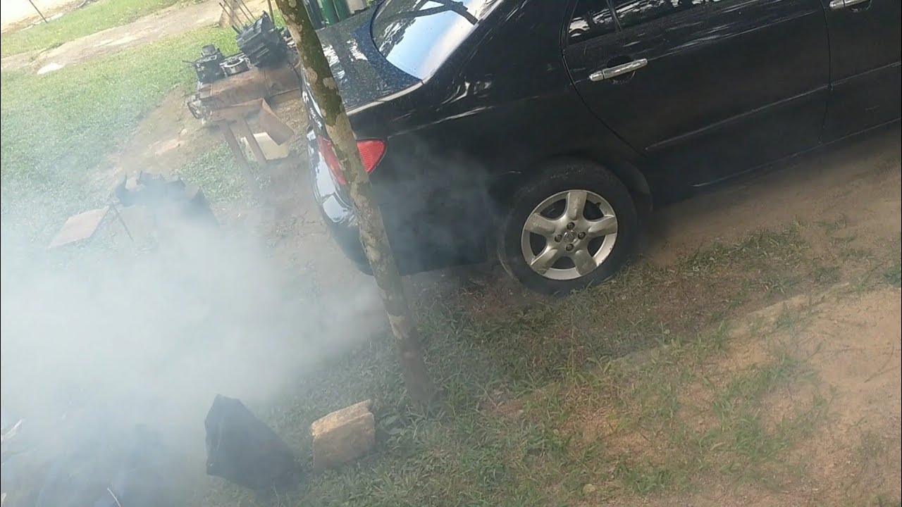 Corolla 1.8 fumando muitooooo