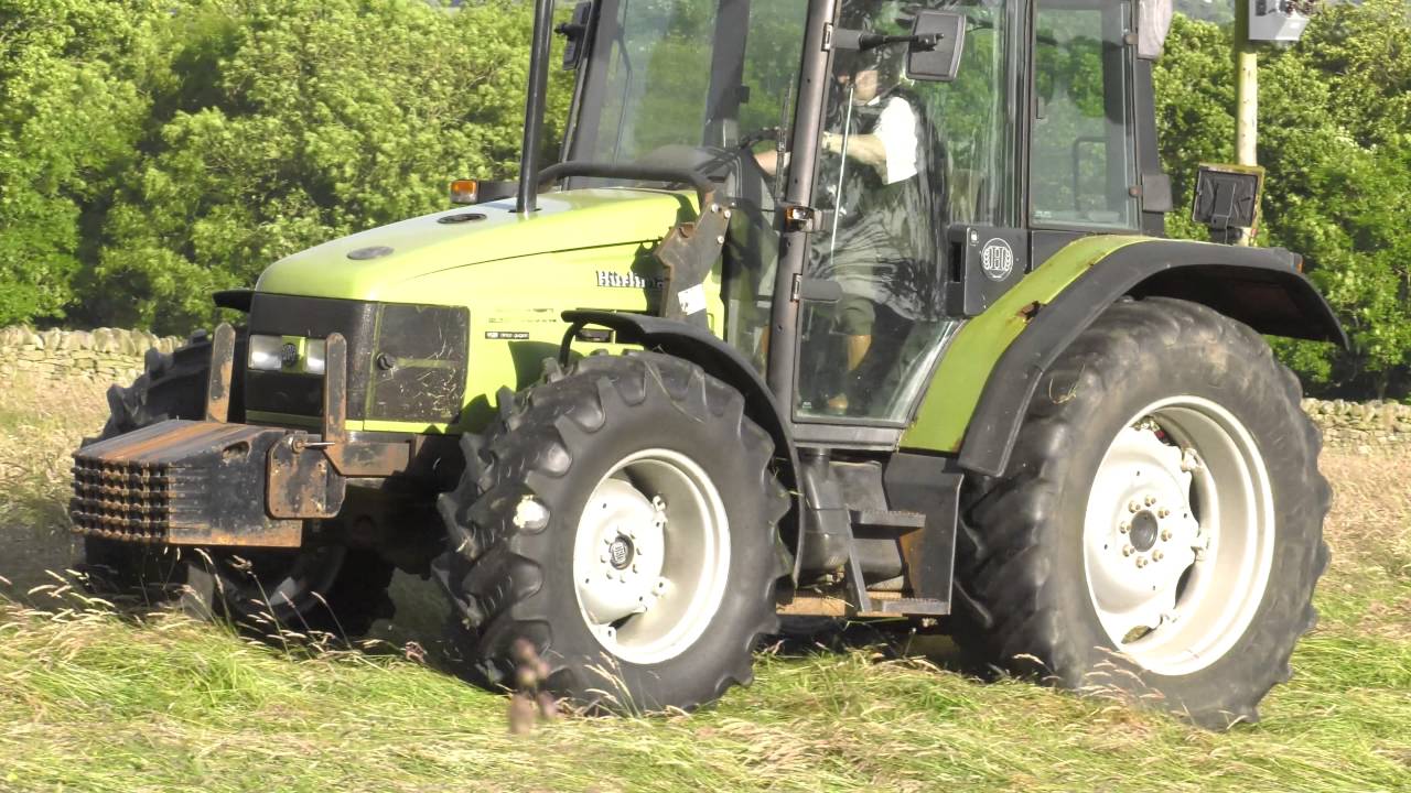 Hurlimann XT909 and PZ Drum Mower Mowing Old Meadow Hay