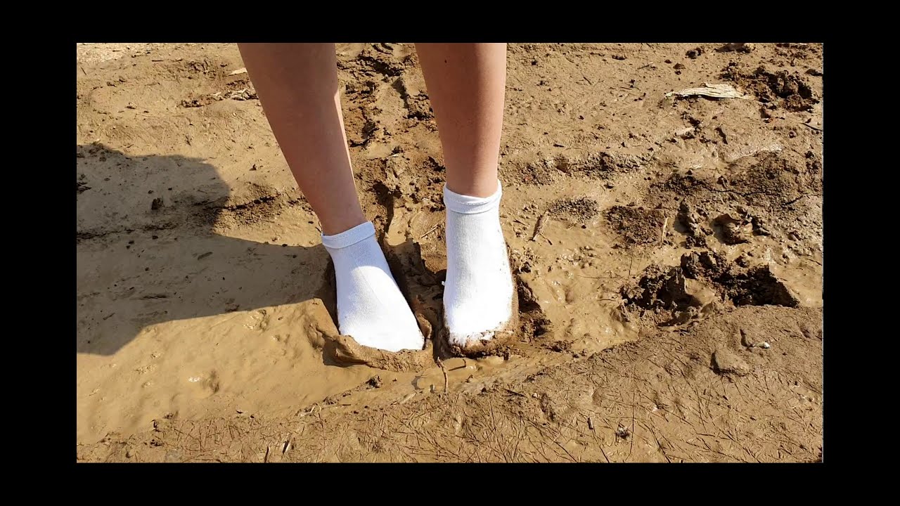 Dirty white socks outdoor wet and muddy, socks in mud, messy socks, dirty socks (# 194)