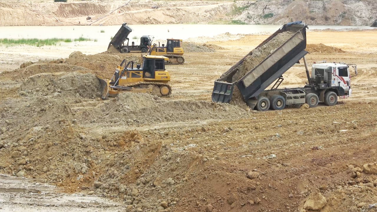 Amazing big pond filling up with soil machinery operating well Shantui dozer and Dump truck